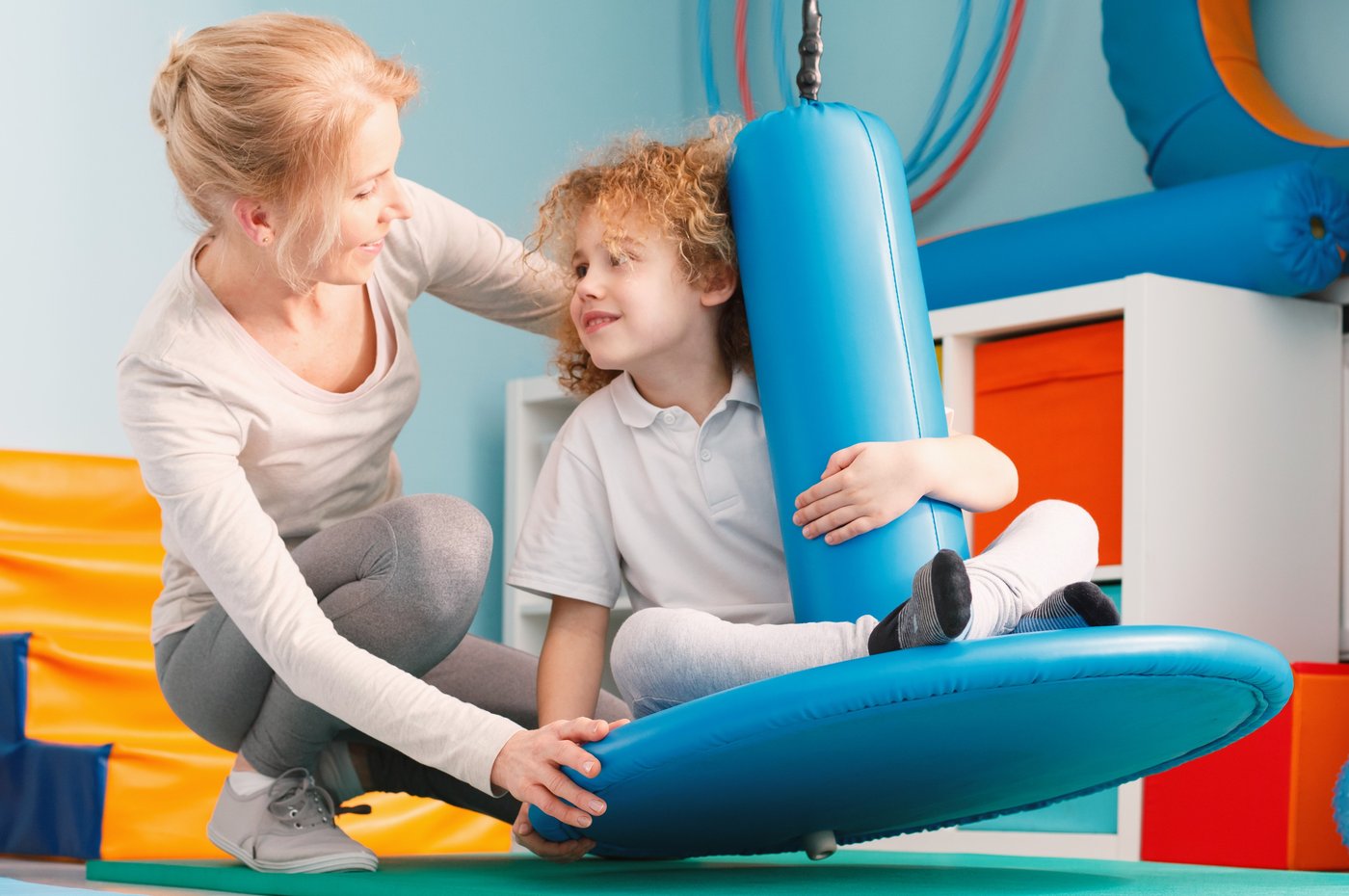 Boy using sensory integration equipment